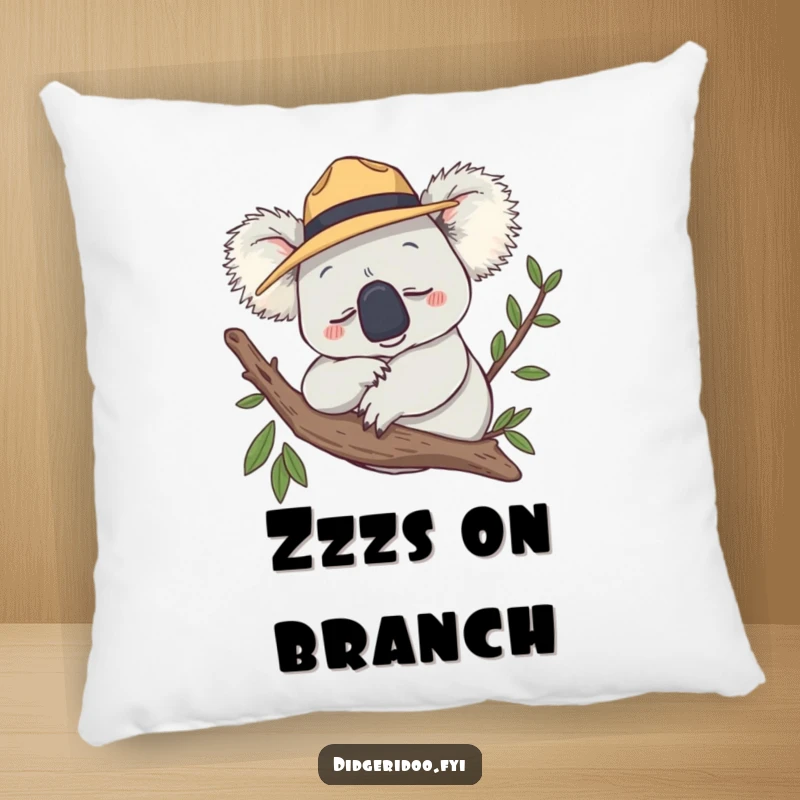 Funny Pillow showing a smiling koala wearing a tiny Akubra hat, snoozing peacefully on a branch.