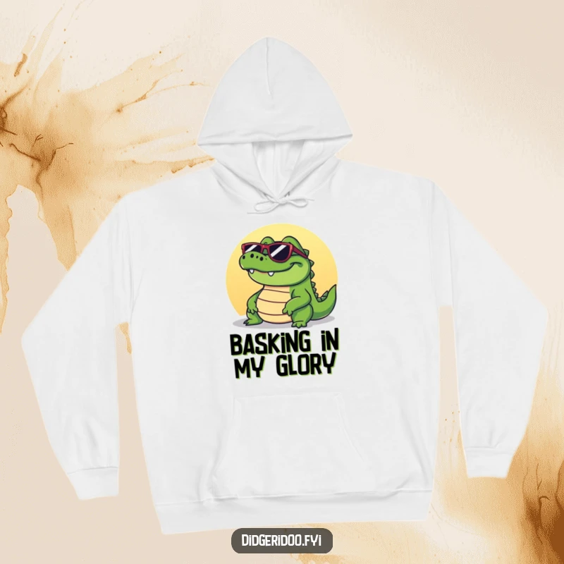 Funny crocodile hoodie depicting a grinning reptile wearing sunglasses, comfortably basking in the sunshine, exuding cool relaxation.