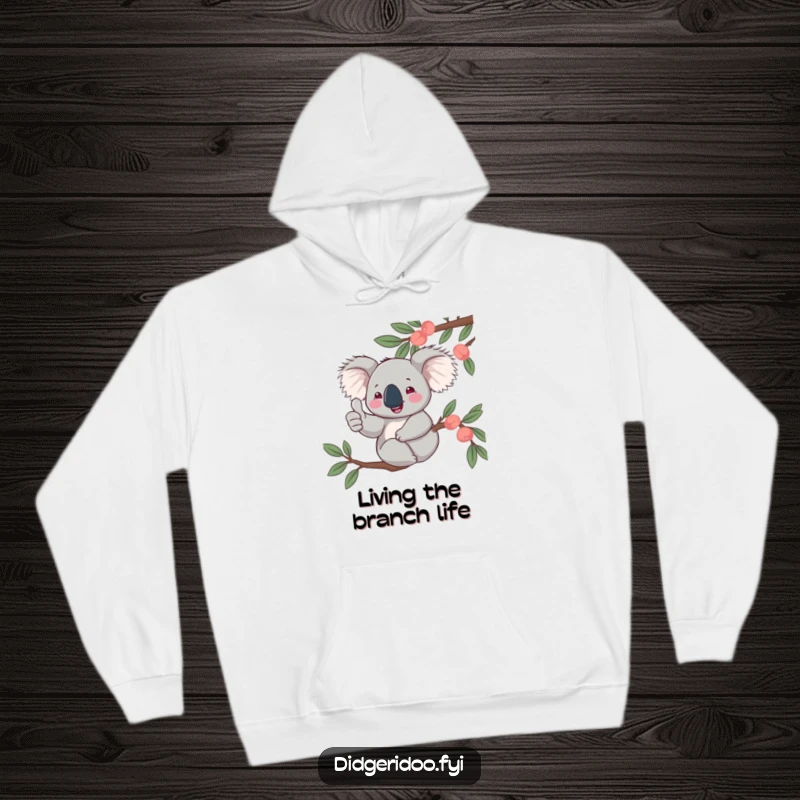 Funny, jovial koala giving a thumbs up from a eucalyptus branch, featured on a cozy hoodie, bringing Aussie comfort and good vibes.