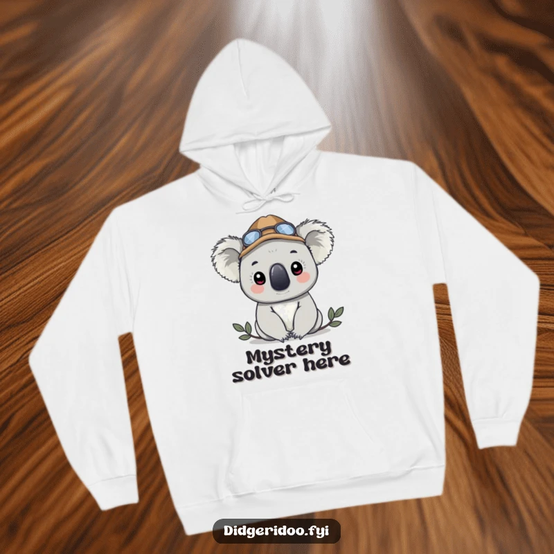 Funny koala in a detective hat, peeking out, depicted on a warm hoodie, perfect for staying cozy and mysterious.