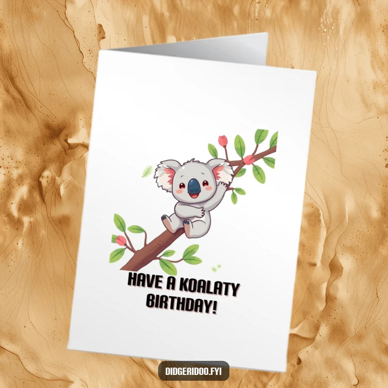 Funny Free Printable Birthday Card: a playful koala joyfully dangling from a eucalyptus branch, wishing you a happy day.