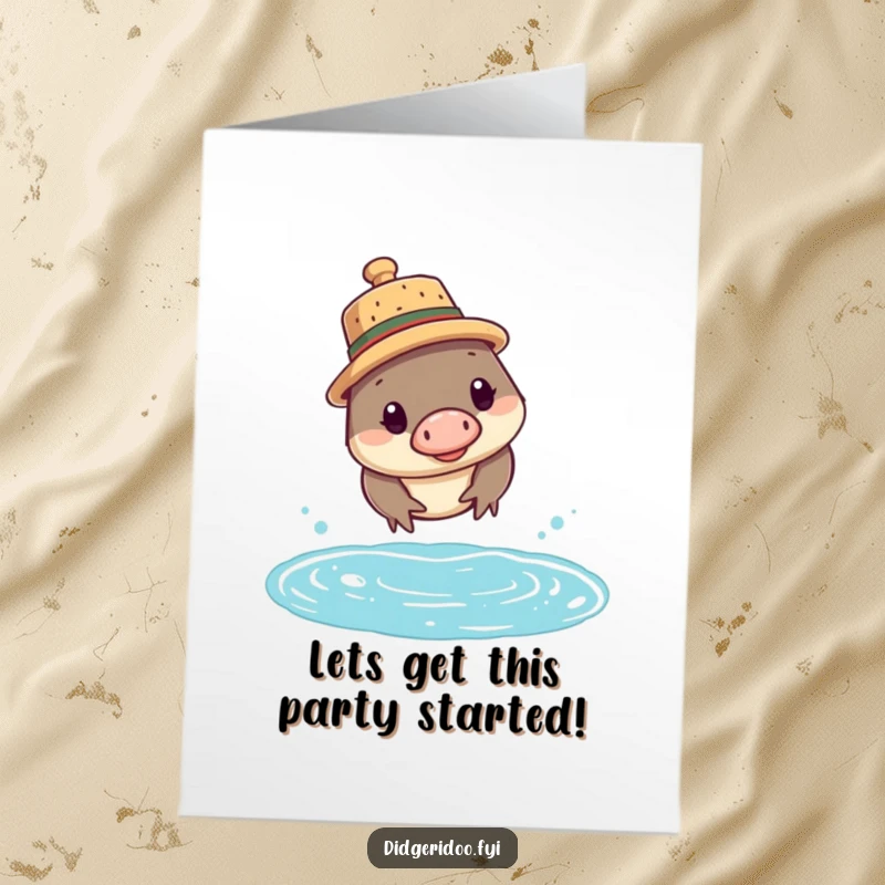 Funny Free Printable Birthday Card featuring a curious platypus in a cork hat diving into water. Quirky downloadable art.