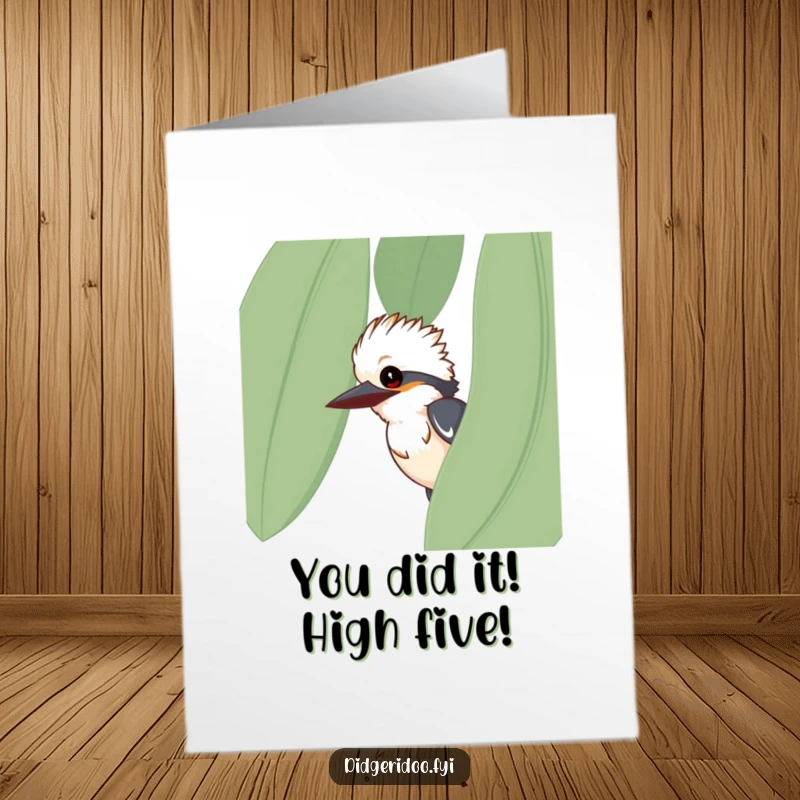 Funny free printable congratulations card showcasing a curious kookaburra peeking from behind a large eucalyptus leaf, perfect for any celebration.