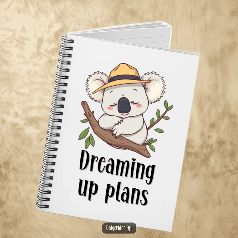 Funny Notebook featuring a smiling koala wearing an Akubra hat, snoozing on a branch, for writing.