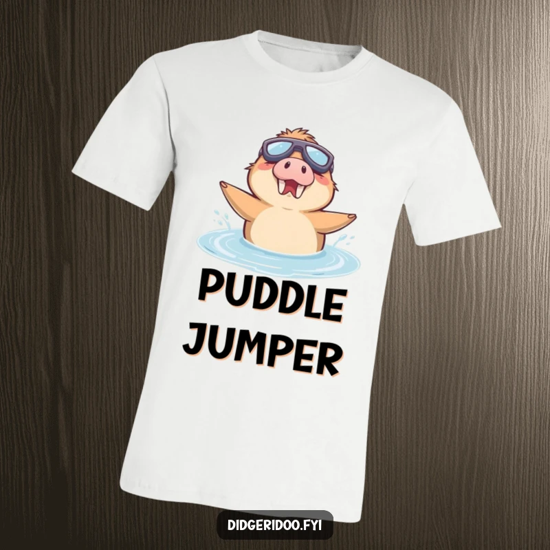 Funny T-Shirt with a delighted platypus character wearing goggles, joyfully swimming in a puddle.