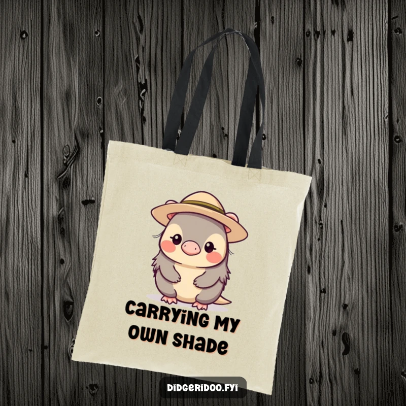 Funny shy platypus character wearing a small, wide-brimmed hat, pictured on a durable tote bag for stylishly quiet carrying.