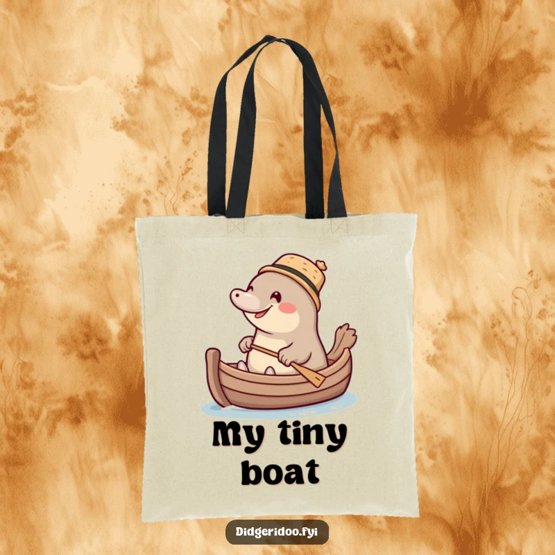Funny giggling platypus wearing a tiny cork hat, paddling a miniature boat, a stylish and humorous tote bag for everyday use.